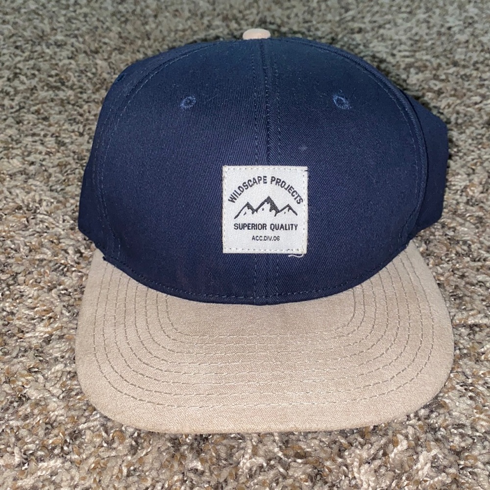 H&M Blue and beige snap back hat.